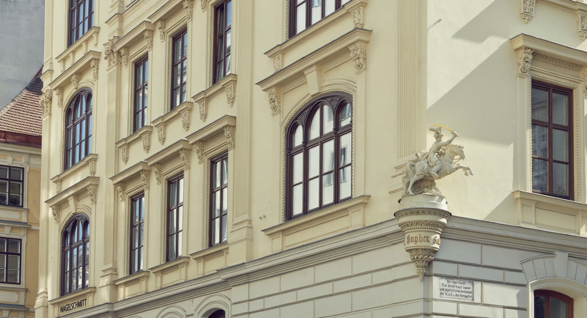 Facade of a classical Viennese building, home to Austria's financial infrastructure.